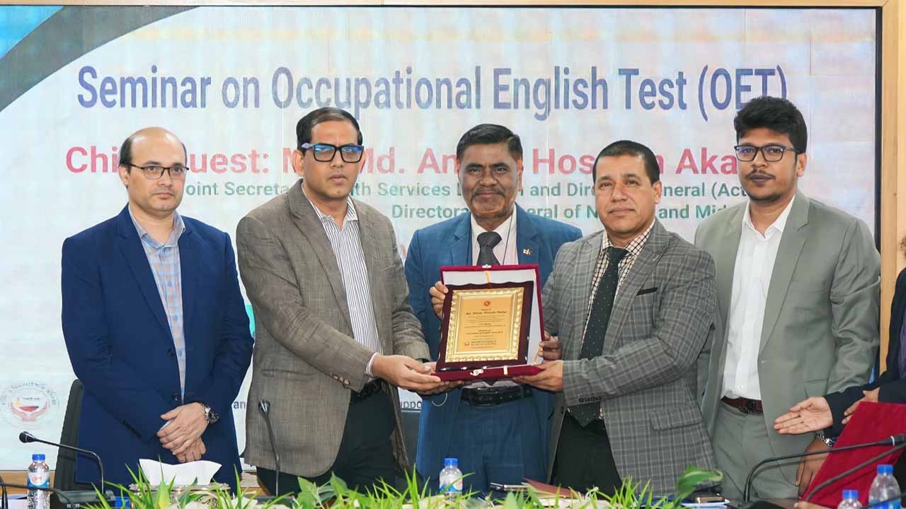 MTI Ltd. representatives receiving a plaque of appreciation at a seminar on the Occupational English Test.