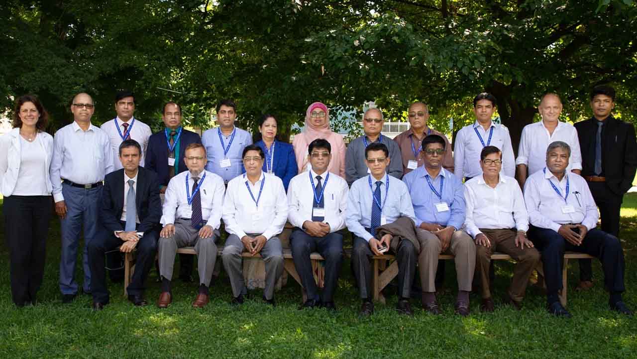 Bangladeshi delegation posing outdoors under trees during the ITC-ILO study tour in Turin, Italy